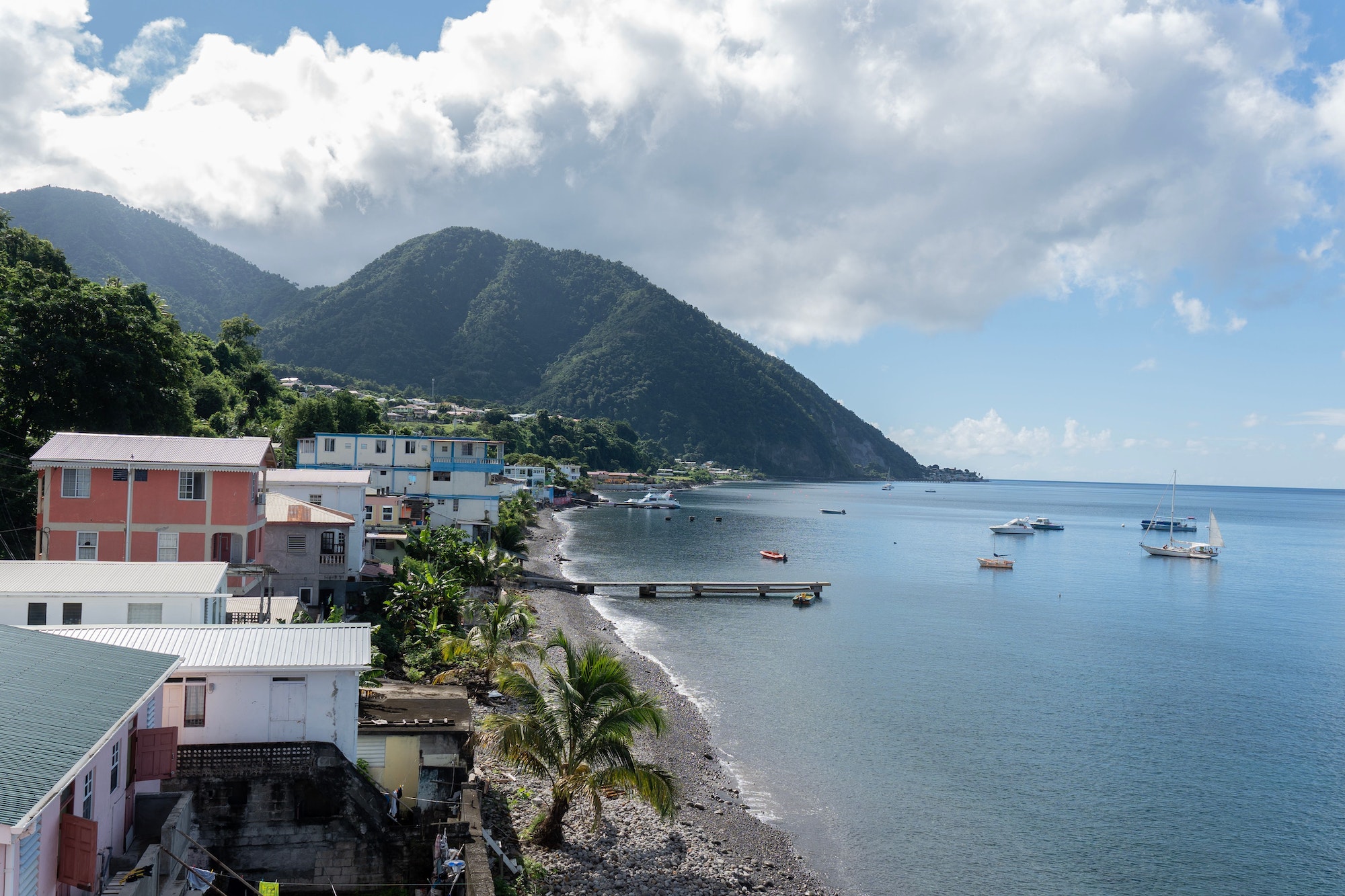 Rocky beach in Dominica, Roseau. Caribbean coastal city with access to the sea